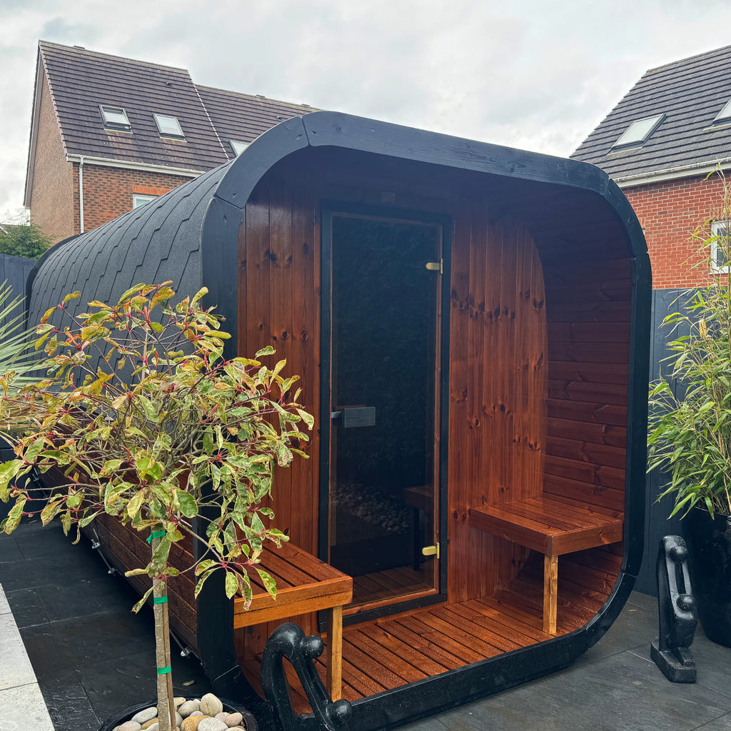 ICON 385 Sauna Installed within customers Garden - finished in clear satin with ebony detailing to front door beading and fascia boards