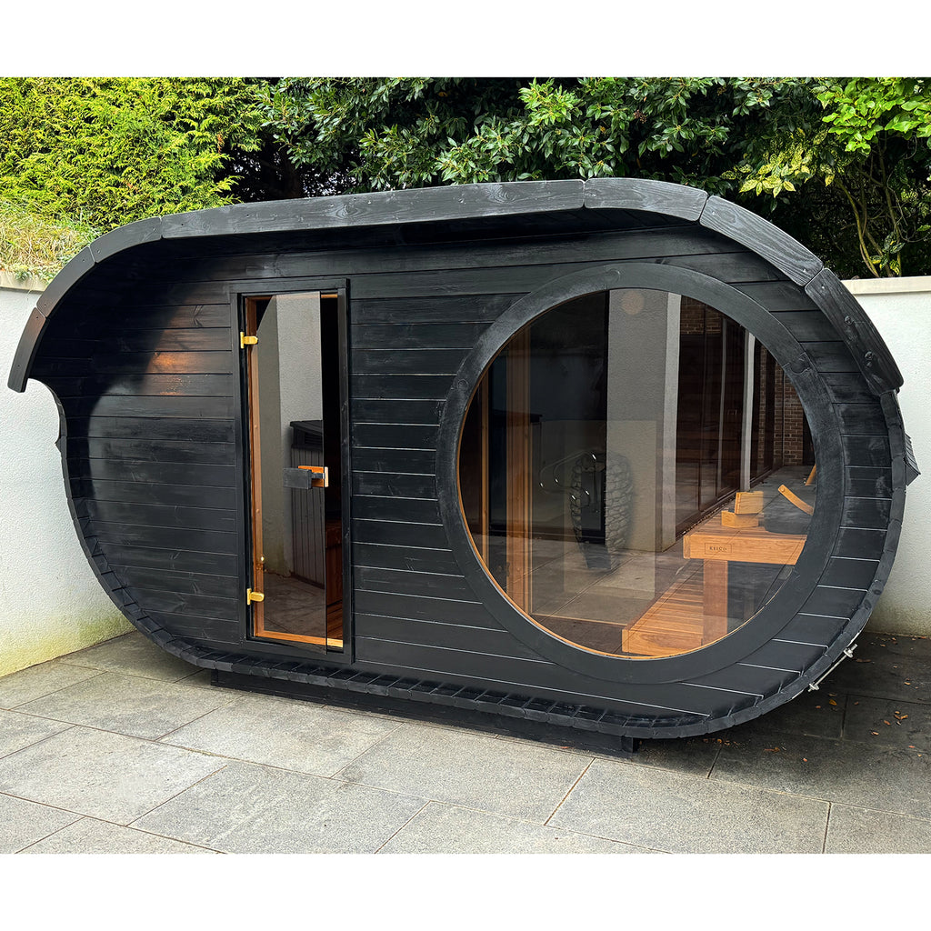 Raiki Outdoor Sauna finished with a protective Black / Ebony Wood Treatment